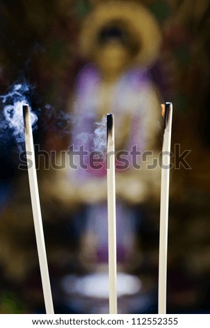 Close-up of burning incense in church during offering