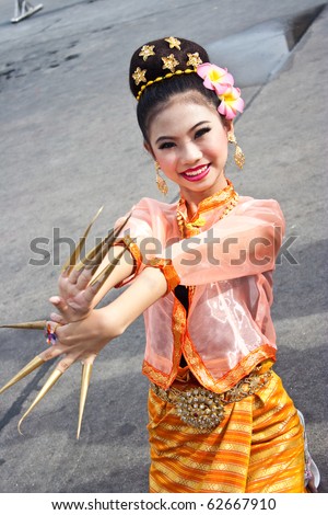 BANGKOK, THAILAND - OCTOBER 3: Thai Traditional Dress. This is the parade of making traditional merit of people from the northern territory of Thailand, October 3, 2010 in Bangkok, Thailand.
