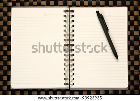 Open blank note book on bamboo texture
