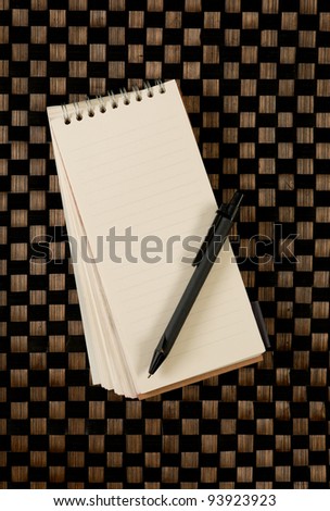 Open blank note book on bamboo texture