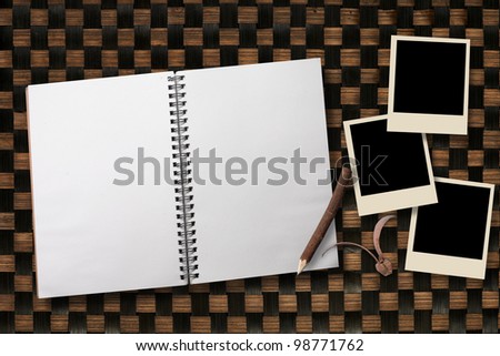 bamboo  background with notebook and photo frame