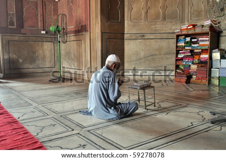 OLD DELHI, INDIA - 24 OCTOBER: An unidentified muslim man prays in Jama Masjid Mosque in Old Delhi on October 24, 2009. Muslim religion is still increasing across the whole India.