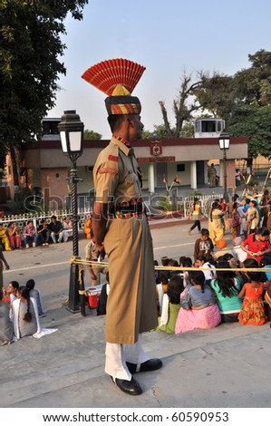 WAGAH BORDER, INDIA - 25 OCTOBER: Member of indian Border Security Forces guards during the everyday ceremonial of closing the gate on indo-pakistan border on October 25, 2009.