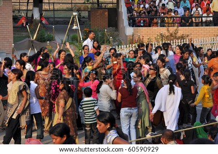 WAGAH BORDER, INDIA - 25 OCTOBER: A group of women dance on indo-pakistan border street on October 25, 2009. It celebrates the ceremonial of closing the gate between India and Pakistan.