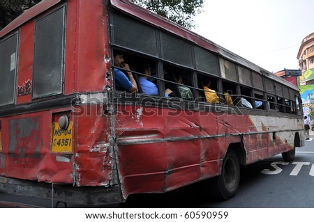 KOLKATA, INDIA - 27 OCTOBER: A group of people travel by bus in Kolkata on October 27, 2009. Unsatisfactory quantity & quality of public transportation limit indian people in everyday traveling.