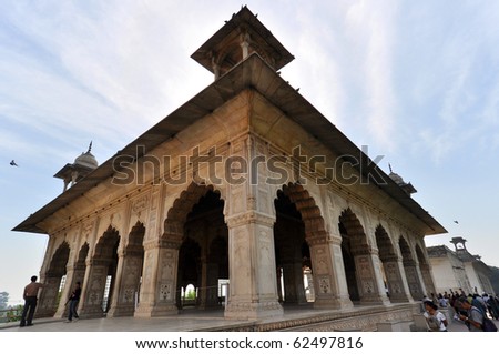 DELHI, INDIA - OCTOBER 24: Group of people enter pavilion in the Red Fort on October 24, 2009. The Red Fort, a UNESCO World Heritage, is one of the most popular tourist destinations in Old Delhi.