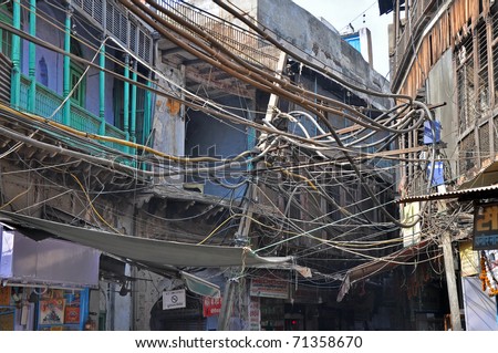 OLD DELHI, INDIA - 24 OCTOBER: Picture of Indian chaotic electrical wiring in Old Delhi on October 24, 2009. Unsatisfying conditions of wiring cause power problems in Delhi.