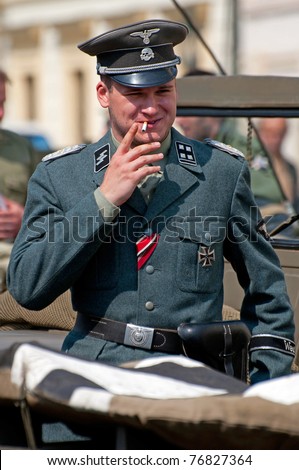 PRAGUE, CZECH REPUBLIC - 29 APRIL: Member of Old Car Rangers club wear historical German uniform on April 29, 2011.It is part of reenactment event - the fall of German army in Prague during WW2.