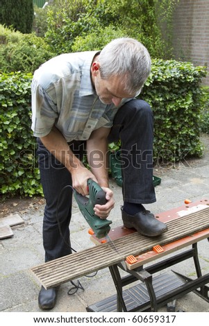 Man Sawing