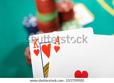 Ace and king cards. Defocused poker chips on a background