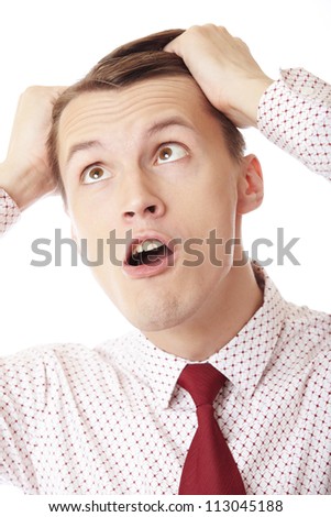 A businessman in trouble screaming on white background
