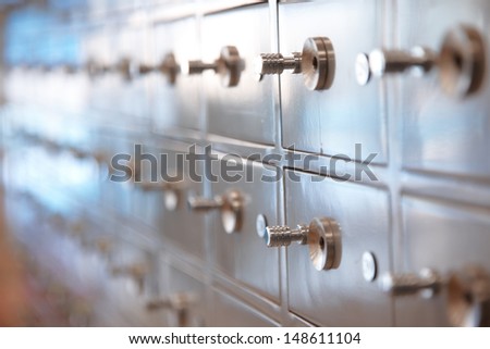 Several safes. Horizontal, closeup view with shallow depth of field