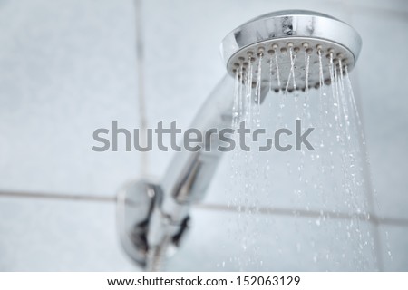 Shower in bathroom with water flowing