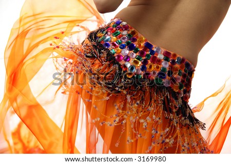 Belly of the woman dancing in the orange dancing dress