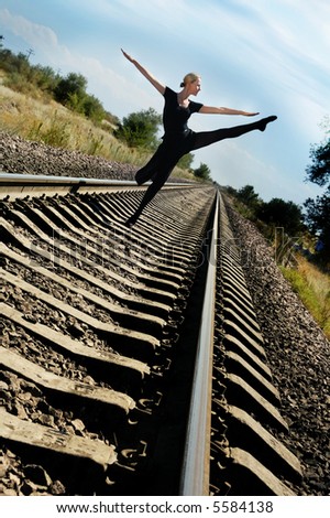Woman dances on railway and does not fear the train