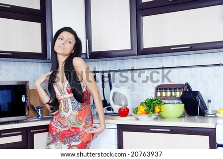 stock-photo-graceful-lady-standing-at-the-kitchen-table-with-fresh-vegetables-20763937.jpg