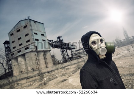 Elhagyott gyárnegyed - Page 3 Stock-photo-human-in-gas-mask-outdoors-and-industrial-factory-on-a-background-52260634