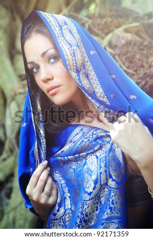 Woman in traditional Indian sari. Outdoors photo