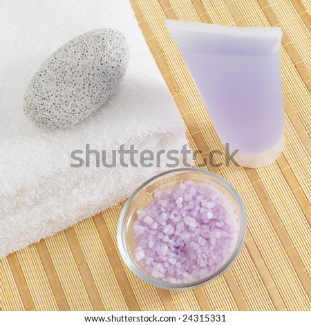 Bath products being displayed on a bamboo mat.
