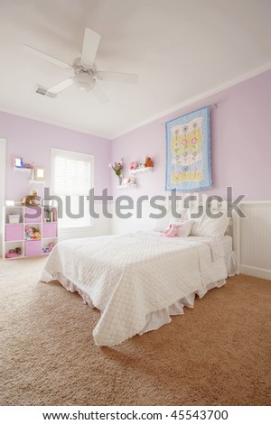 Wide angle view of a girl\'s bedroom. Vertical format.