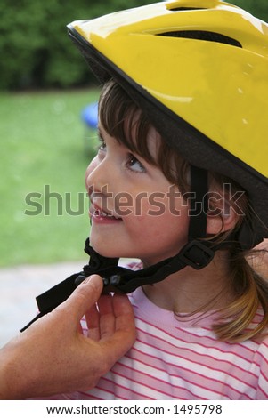 young child with bicycle helmet in yellow - personal safety