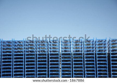 stack of blue palette of the logistic company - blue sky in background