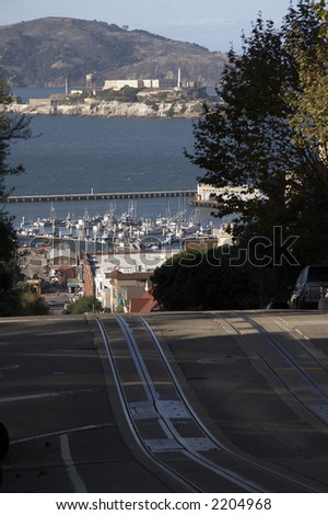 Road Network in San Francisco with Alcatraz and San Francisco Bay in background and car in front