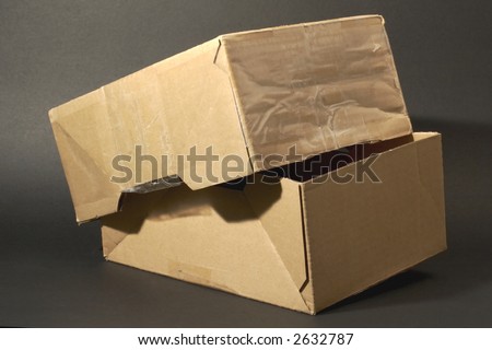 beige parcel box in front of black background