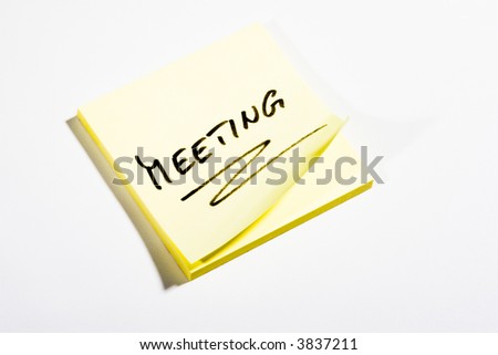 Yellow Post-It with MEETING - on white background