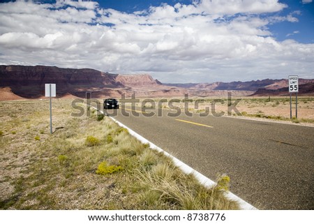 Highway in front of Vermillion Cliffs National Monument in Arizona, USA