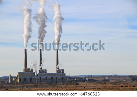 Coal power plant smokestacks fill the morning air