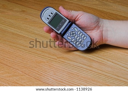 cellular phone in palm of hand