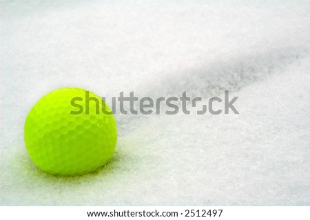 yellow ball for winter golf on to snow