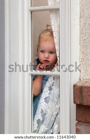 Abandon Child - little girl waiting by window for parent to return