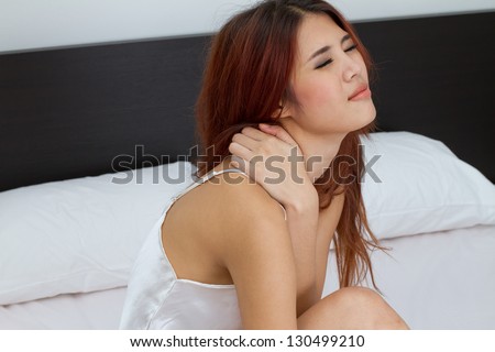woman at home with neck or shoulder or upper back pain, stiff muscle and joint, stress, sickness from working, office syndrome concept