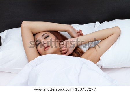 restless sleeping woman moving nervously