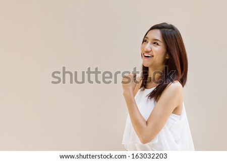 happy, positive, smiling, confident woman on plain background with space for text