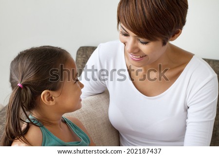 happy mother and daughter talking