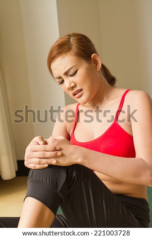 fitness woman with knee joint injury