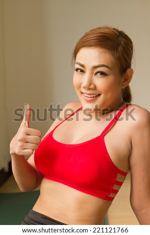 fitness woman giving thumb up