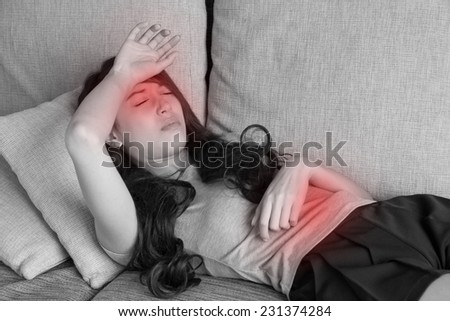 sick woman with multiple symptoms, resting and lying down in home, indoor scene