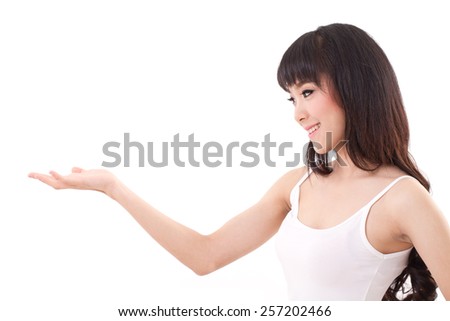 happy, smiling, content woman raising her hand showing, displaying blank space for adding on something