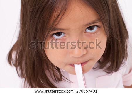 closeup portrait of cute little girl with sugar jelly