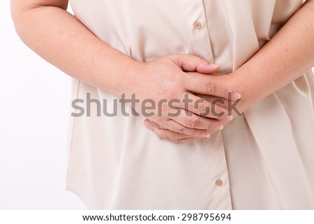 middle aged woman suffering from stomach ache, belly pain, menstuation, menopause, indigestion problem