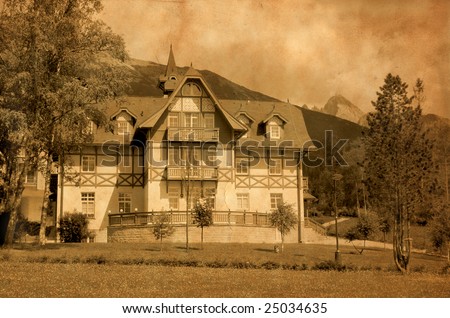 Old hotel in High Tatras region in Slovakia. Aged photo effect