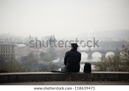 Sad man in autumn park, Prague