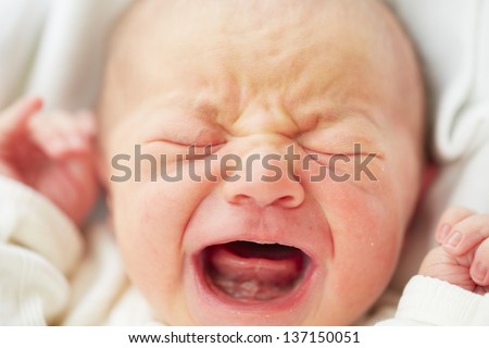 Newborn baby is crying - selective focus