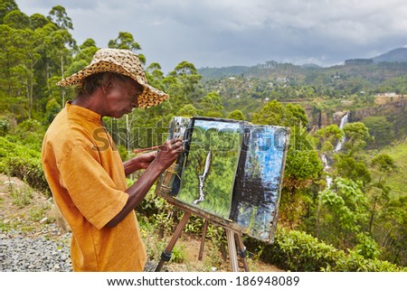 NUWARA ELIYA, SRI LANKA - April 8 : Painter is painting Devon Falls near Nuwara Eliya on April 8, 2014. In the picture is 97 m high waterfall in central part of Sri Lanka.