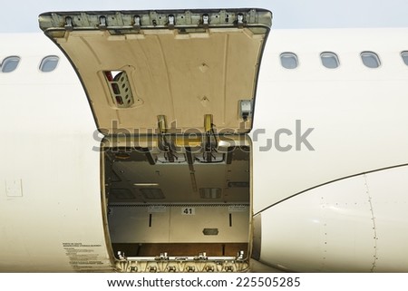 Open cargo door of the commercial airplane