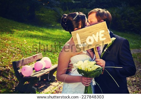Wedding day - young couple in park